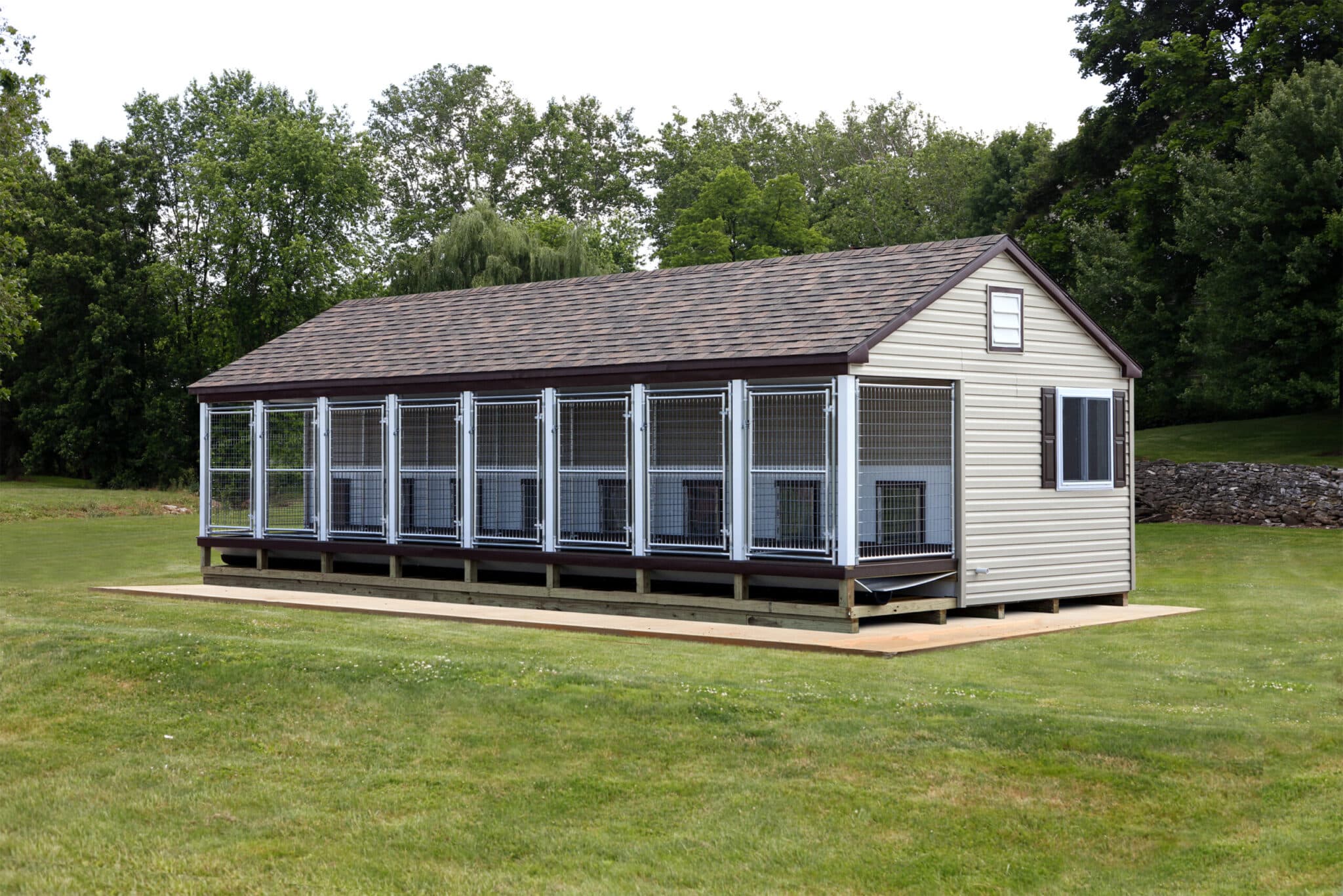 gray dog kennel with 8 outdoor runs