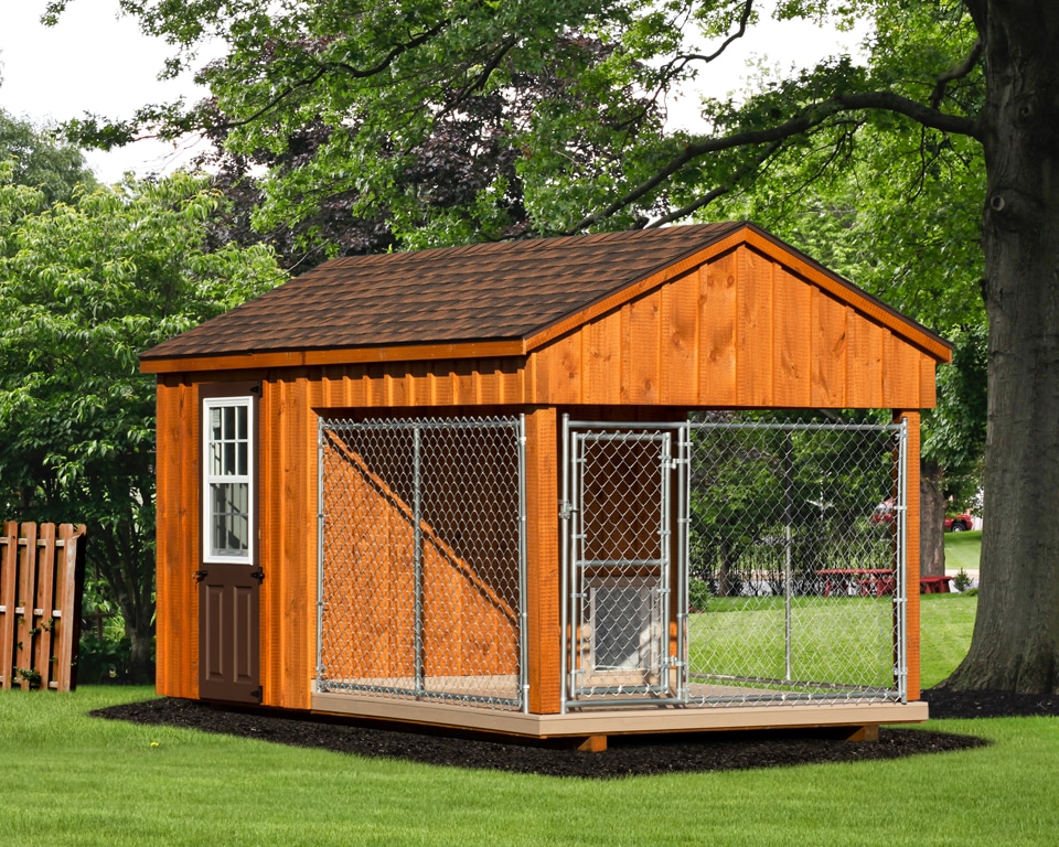 wooden dog kennel with an attached run