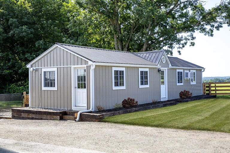 luxury cream dog house with kennels with white trim windows and doors for sale in Fort SMith AR