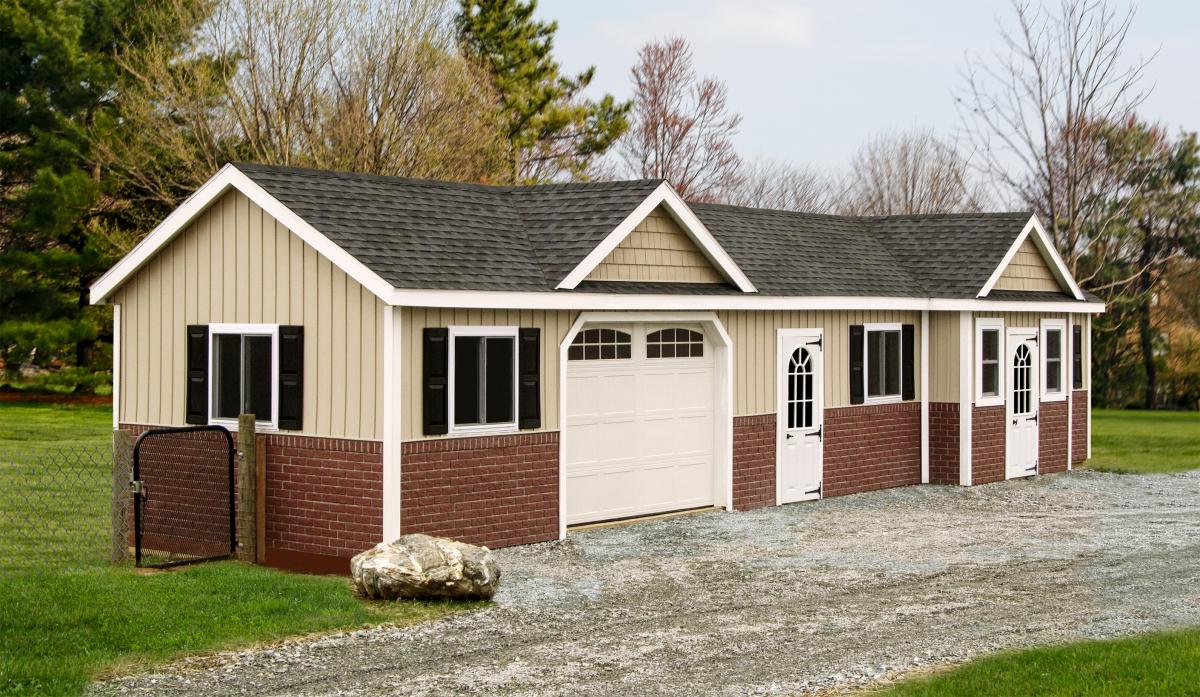 tan commerical dog kennel with tan and brick trim garage door and shingle roof