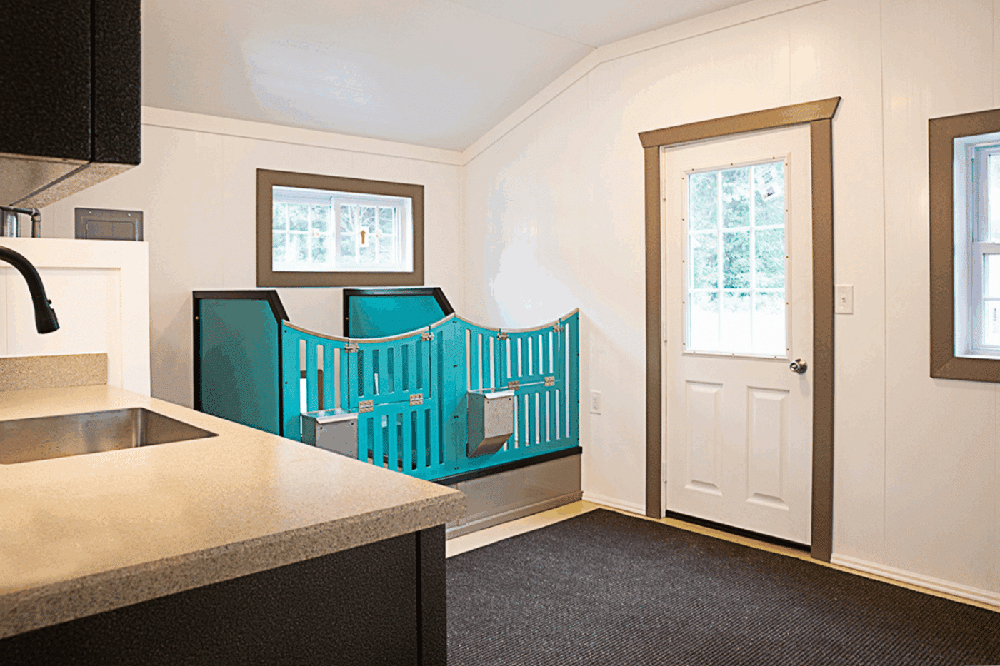inside of commercial dog kennel with sink and door in north carolina