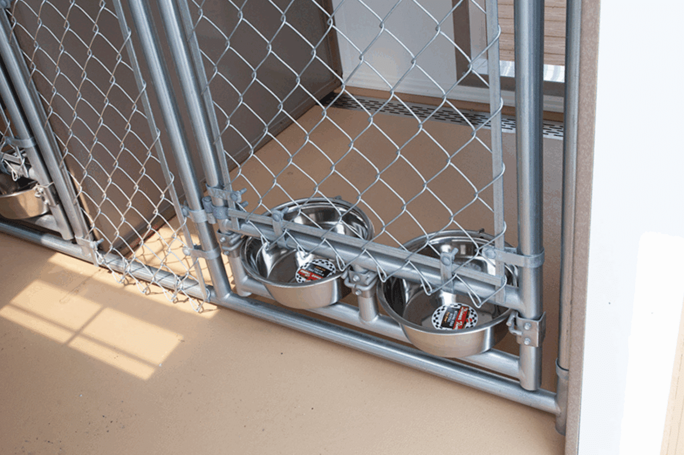 interior of kennel with two food bowls for kennel business in rhode island