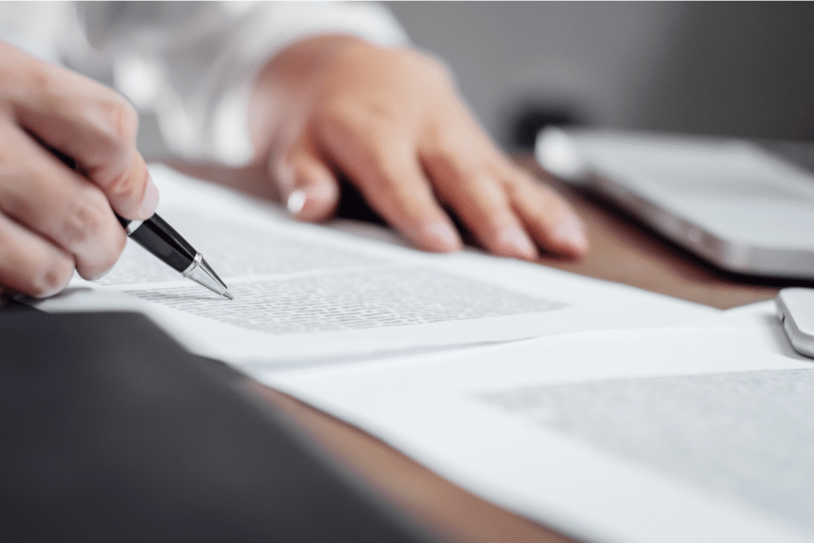 man clearly outlining policies and procedures on paper