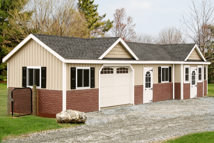 tan and red brick commercial dog kennel with gray asphalt shingle roof