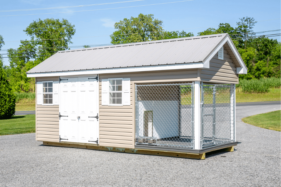 tan residential dog kennel with metal roof to keep dogs warm during winter