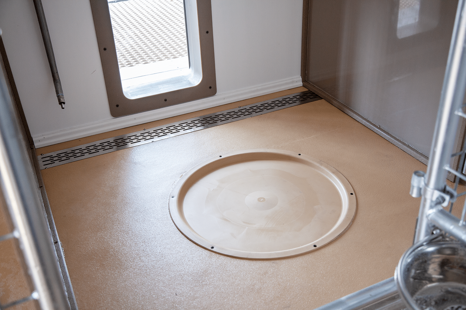 Whelping pad on the floor of a commercial dog breeding kennel.